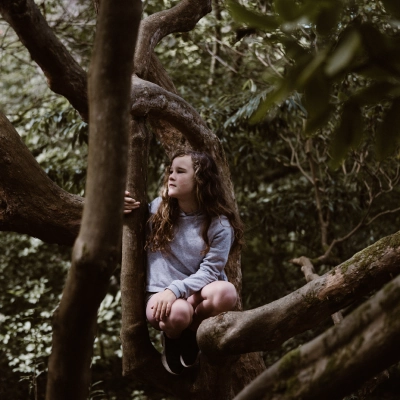 Girl sat in tree